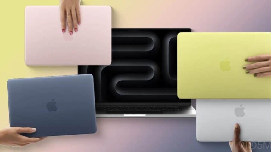 Quattro MacBook Neo in diverse colorazioni sono disposti attorno a un portatile aperto con il numero 20 mostrato sullo schermo.