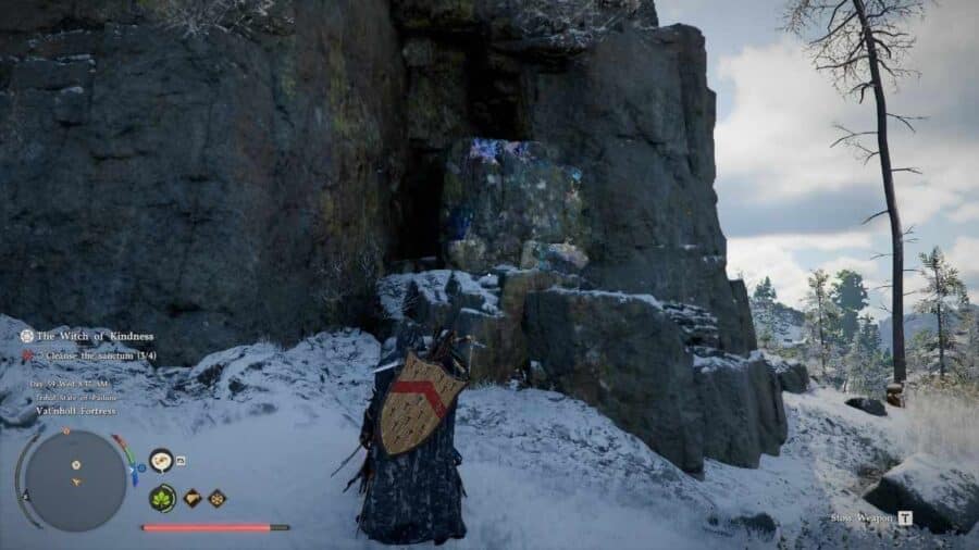 Il protagonista di Crimson Desert si trova davanti a una parete rocciosa innevata con tracce di minerale brillante, in una zona montana del mondo di Pywel.