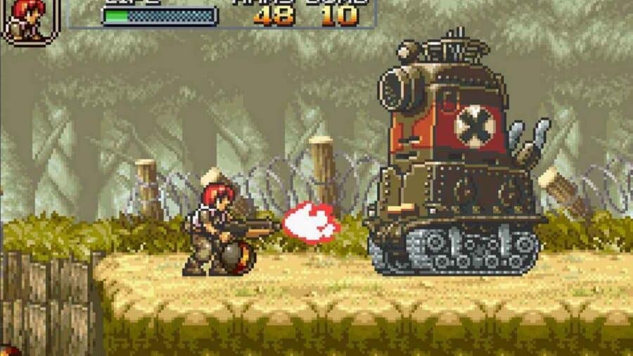 Schermata gameplay di Metal Slug in pixel art con un soldato che spara contro un carro armato nemico in un livello a scorrimento laterale.