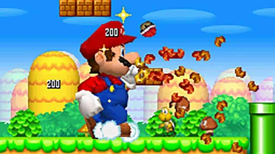 Schermata di gioco di New Super Mario Bros. con Mario gigante che attraversa il livello travolgendo nemici e blocchi tra tubi verdi e colline colorate.