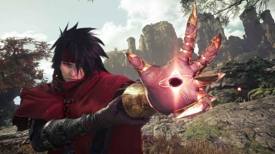 Vincent Valentine in Final Fantasy VII Revelation mostra il suo artiglio metallico illuminato da un’energia oscura.