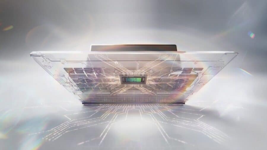 Render tecnico di un laptop ultra-sottile con componenti interni e chip centrale illuminati da linee digitali.