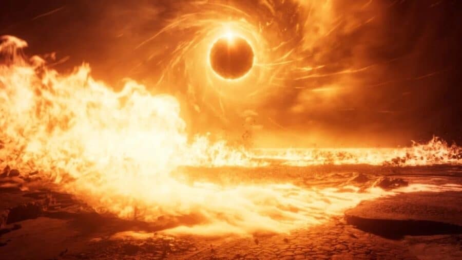 Paesaggio infuocato di SAROS con un’eclissi arancione nel cielo, fiamme e onde di energia che attraversano la superficie di Carcosa.