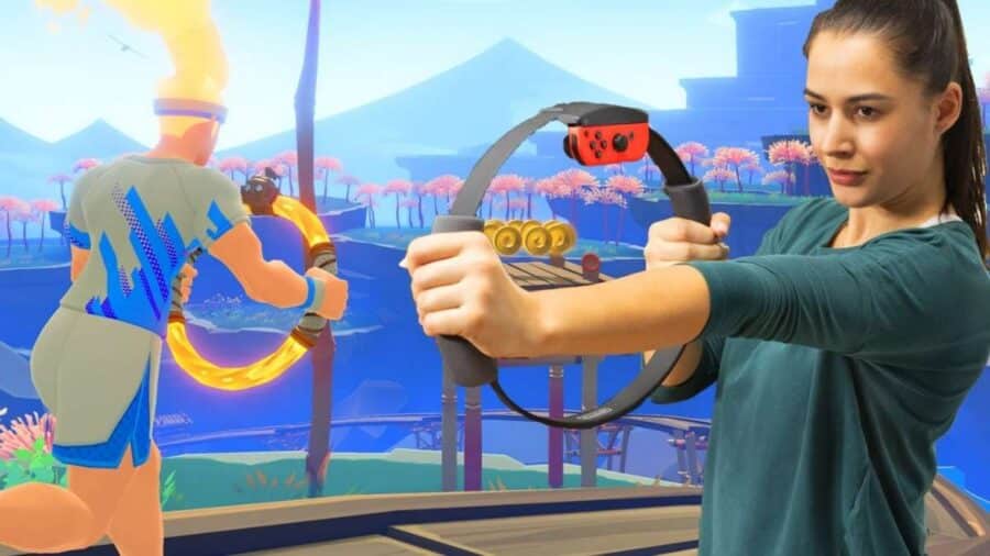 Donna utilizza il Ring-Con di Nintendo Switch davanti alla schermata di Ring Fit Adventure, durante un esercizio guidato dal videogioco.