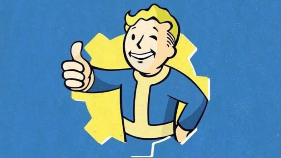 L'iconica mascotte Vault Boy, un ragazzo biondo sorridente con la tuta blu del Vault, fa l'occhiolino e mostra il pollice in su, incorniciato da una forma a ingranaggio gialla su sfondo blu.
