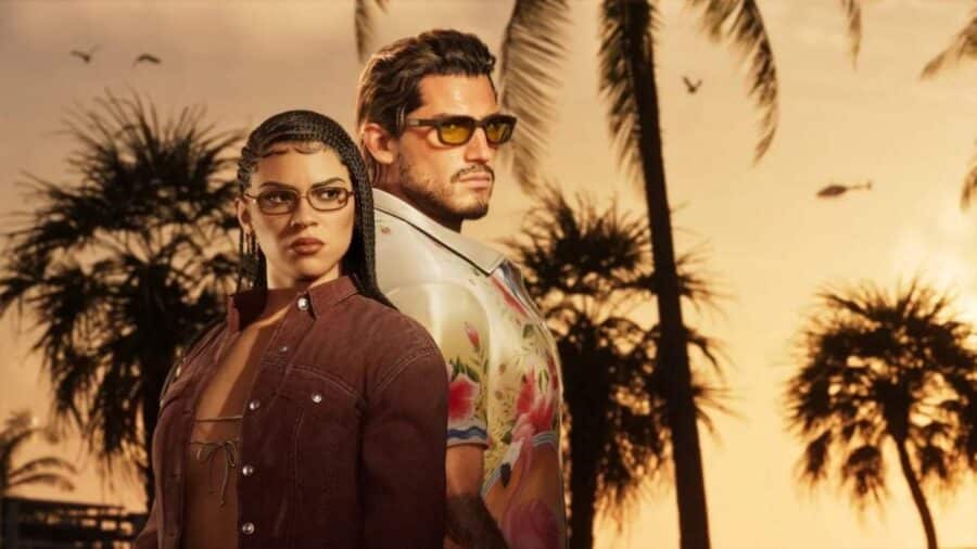 I due protagonisti di GTA 6, Lucia e Jason, ripresi a mezzo busto al tramonto, con occhiali da sole e folte palme sullo sfondo.