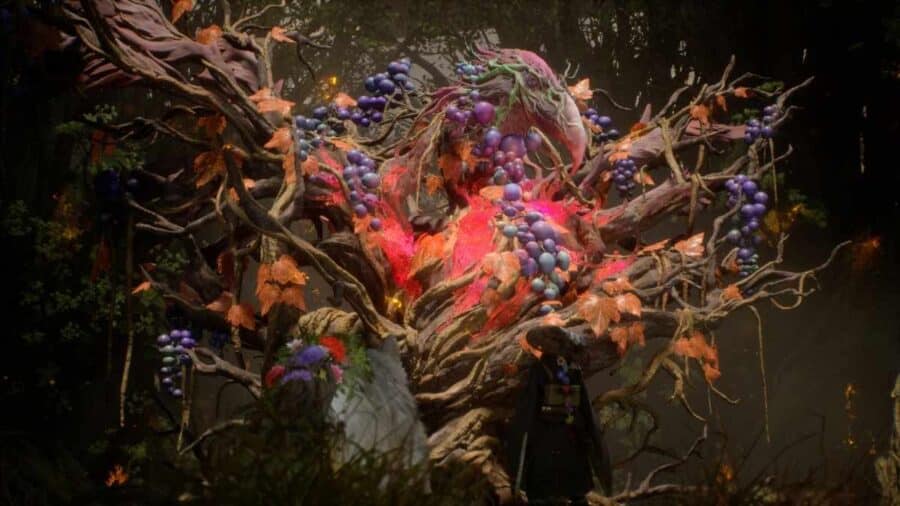 I due protagonisti al cospetto di una mostruosità vegetale, simile a un gigantesco albero corrotto con un nucleo rosso fuoco, fogliame autunnale ed escrescenze violacee.