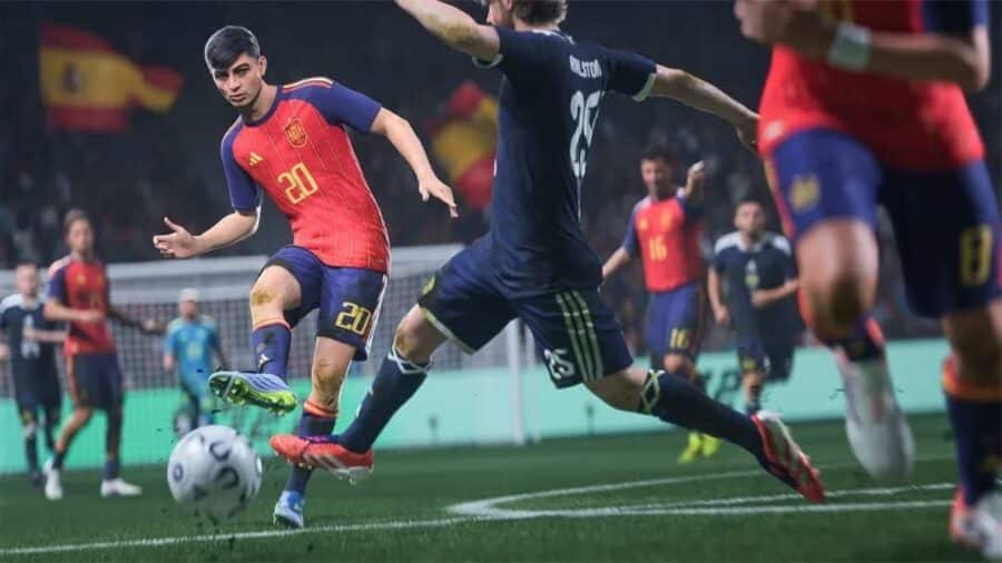 Azione dinamica in EA Sports FC 27: il centrocampista Pedri, con la maglia rossa della nazionale spagnola, controlla il pallone mentre un difensore avversario in maglia blu tenta di fermarlo.