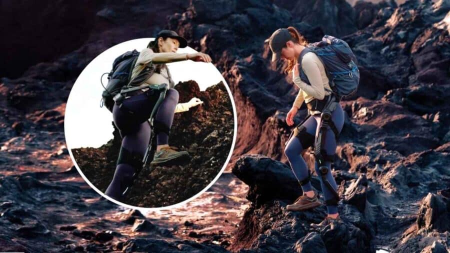 Escursionista che indossa l'esoscheletro per gambe Hypershell Halo su una distesa di roccia vulcanica scura, con dettaglio circolare che mostra l'articolazione del ginocchio durante una salita ripida.